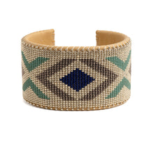 A beaded bracelet with geometric patterns in beige, blue, and green colors.