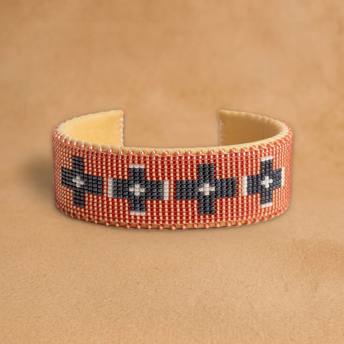 Faith Large beaded cuff, coral with charcoal and white crosses, handloomed by Navajo artisans in New Mexico