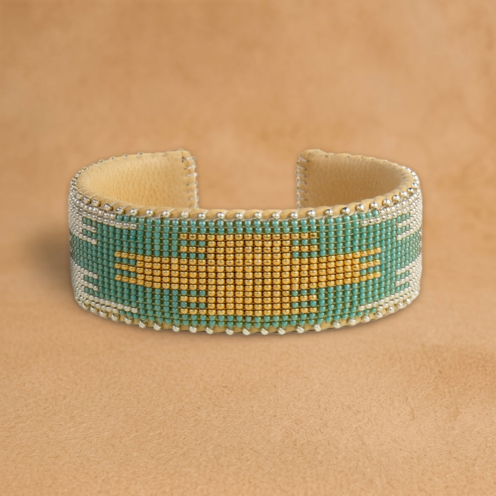 Fiona Large beaded cuff, turquoise with a gold and silver flame center, handloomed by Navajo artisans in New Mexico