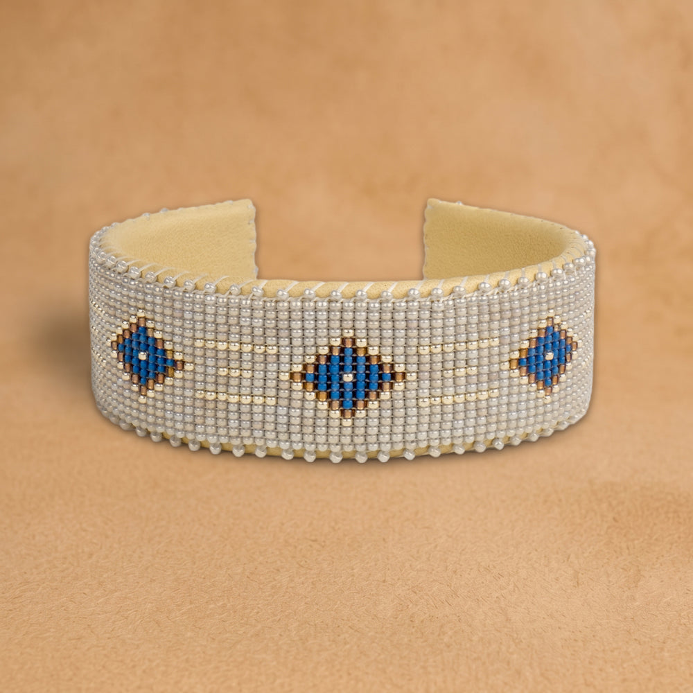 Grace Large beaded cuff, pale silver with cobalt blue diamonds outlined in gold, handloomed by Navajo artisans in New Mexico