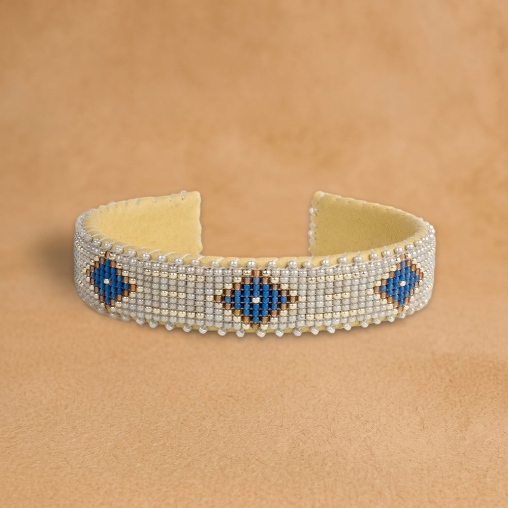 Grace Small beaded cuff, pale silver with cobalt blue diamonds outlined in gold, handloomed by Navajo artisans in New Mexico