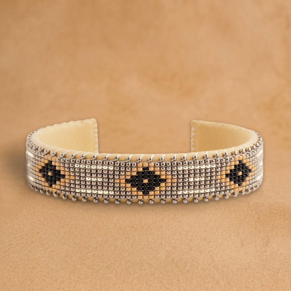 Harmony Small beaded cuff, silver with black diamonds outlined in peach, handloomed by Navajo artisans in New Mexico