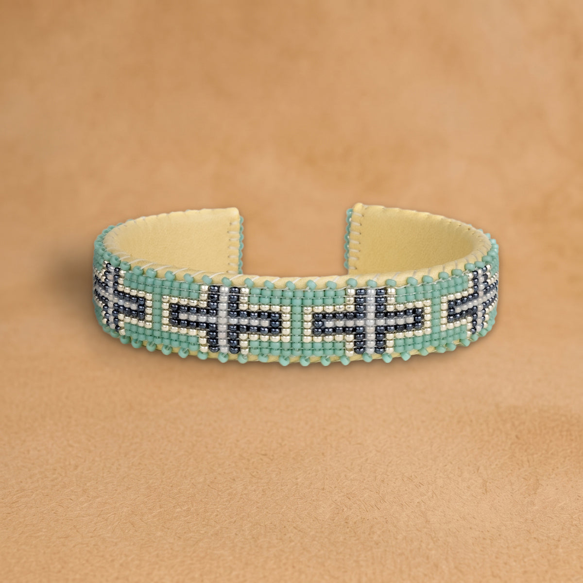 Juliayn Small beaded cuff, turquoise with navy and white crosses, handloomed by Navajo artisans in New Mexico