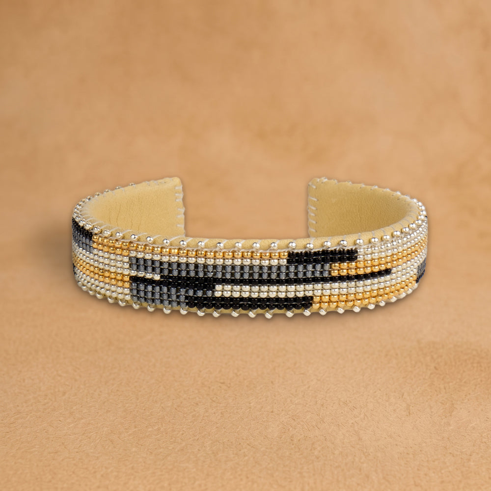 Kalani Small beaded cuff, cream, gold, black and grey offset bars, handloomed by Navajo artisans in New Mexico