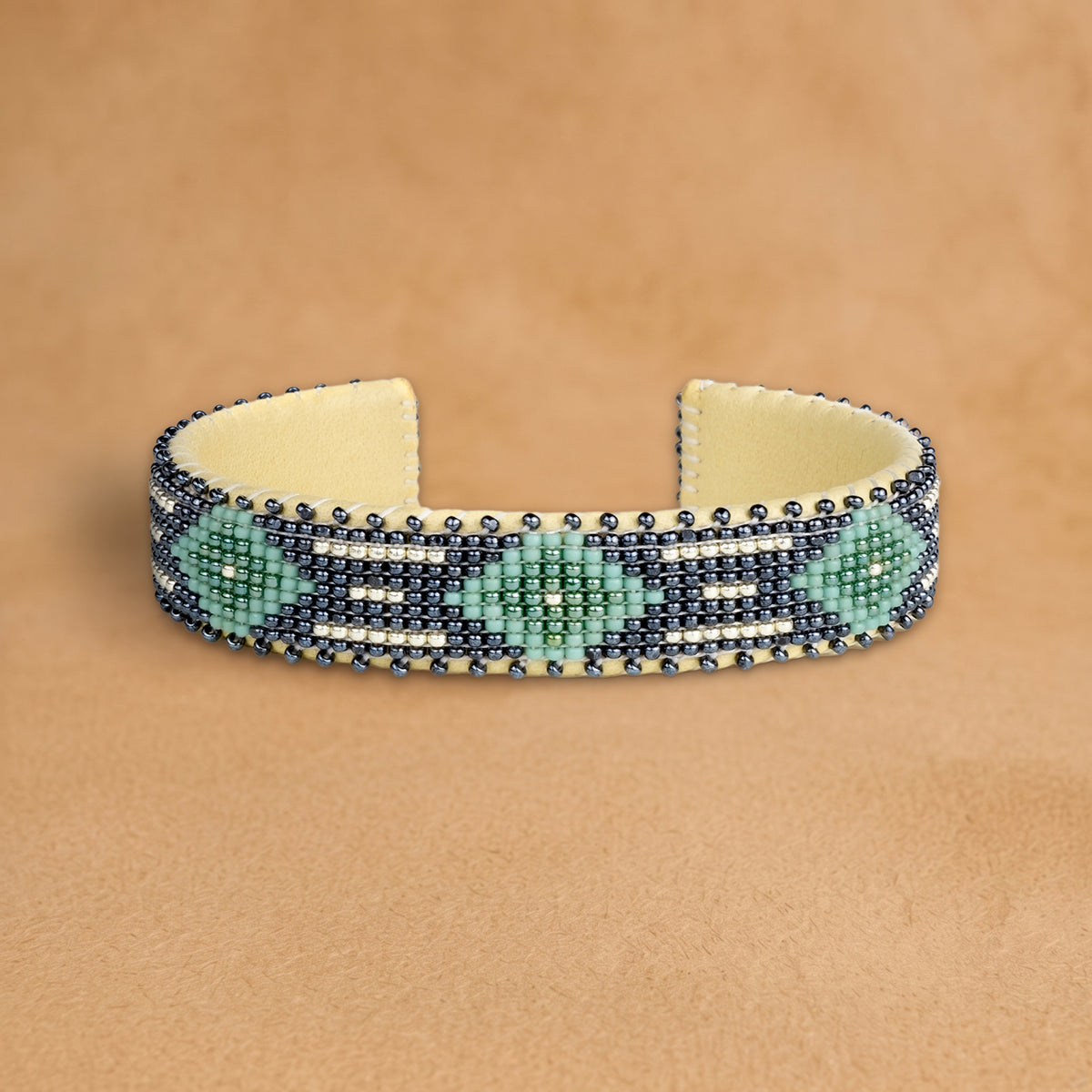 Kelly Green Small beaded cuff, navy with seafoam green diamonds and white dashes, handloomed by Navajo artisans in New Mexico