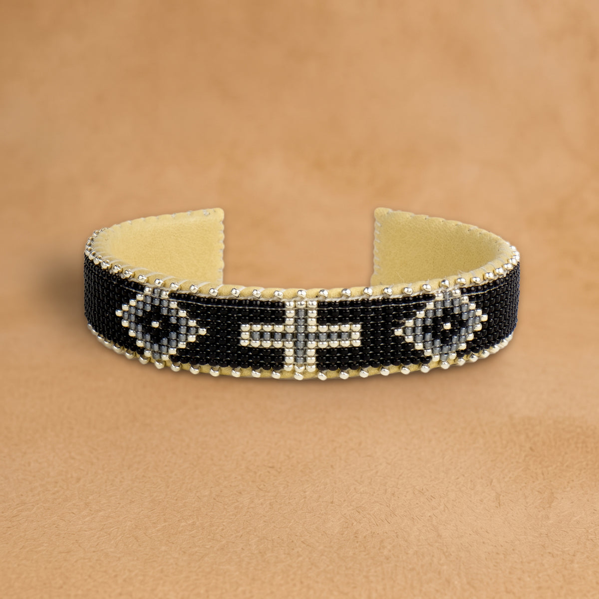Lolita Small beaded cuff, black with grey diamonds and a silver cross, handloomed by Navajo artisans in New Mexico