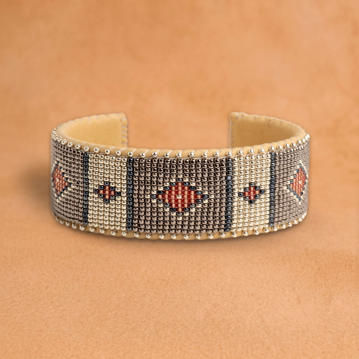 Mattie Large beaded cuff, silver and white panels with charcoal stripes and coral diamonds, handloomed by Navajo artisans in New Mexico