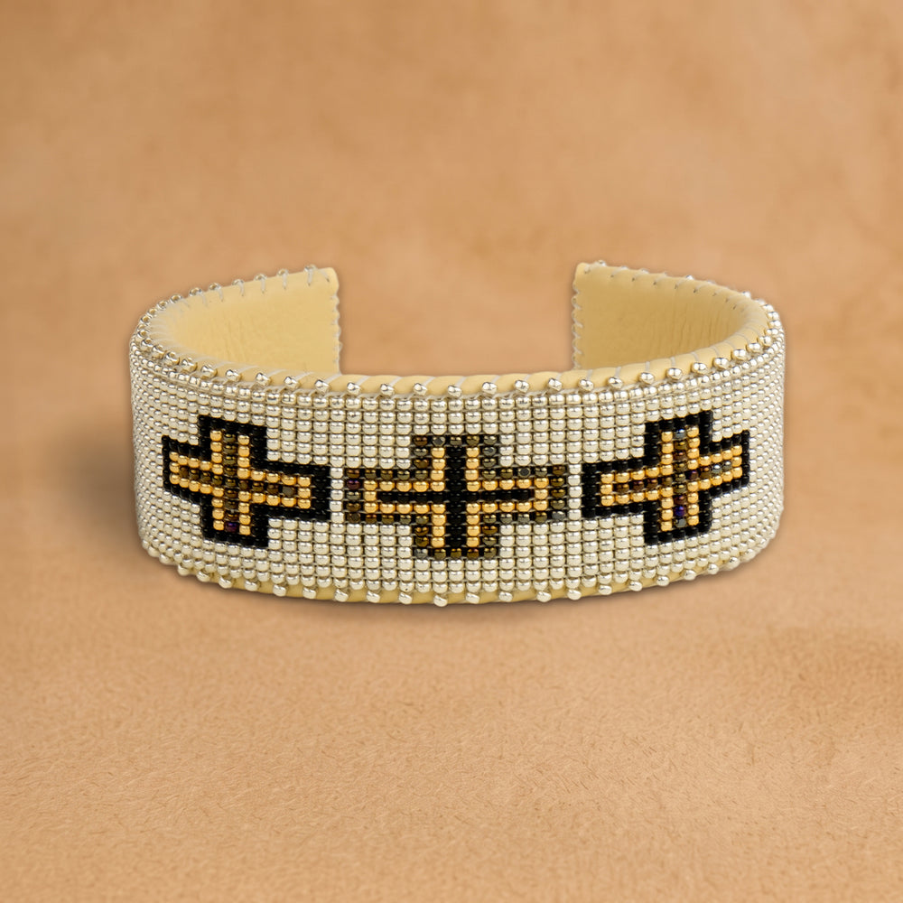 Owen Large beaded cuff, white with black and gold crosses, handloomed by Navajo artisans in New Mexico