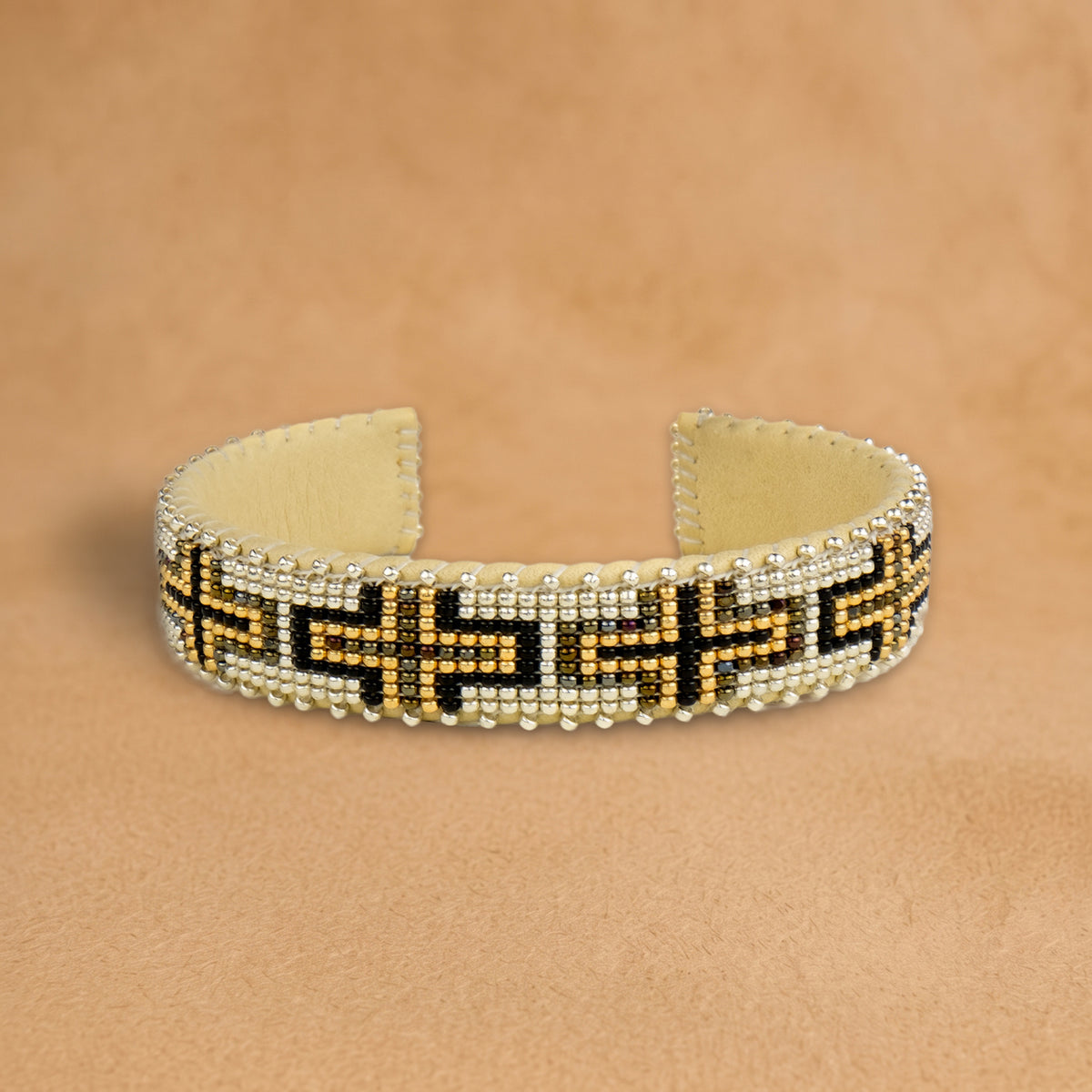 Owen Small beaded cuff, white with black and gold crosses, handloomed by Navajo artisans in New Mexico