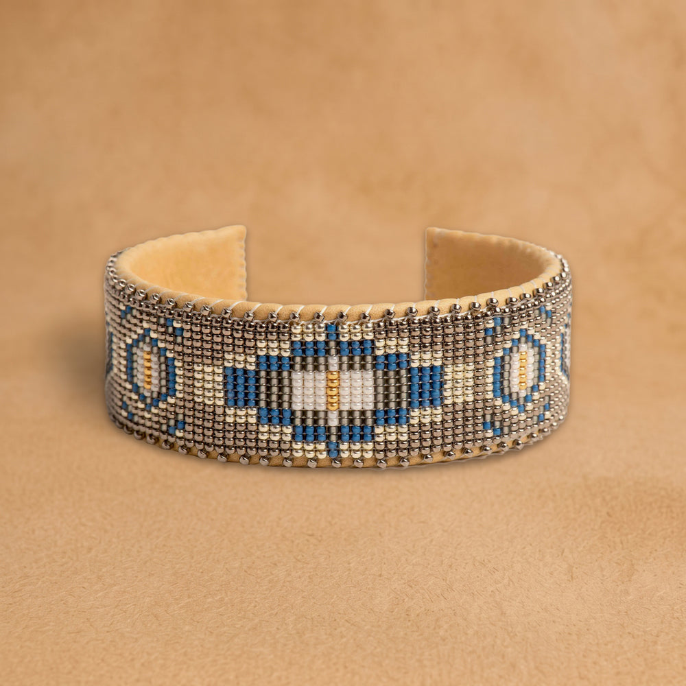 Paloma Large beaded cuff, taupe with a cobalt blue, black and cream medallion, handloomed by Navajo artisans in New Mexico