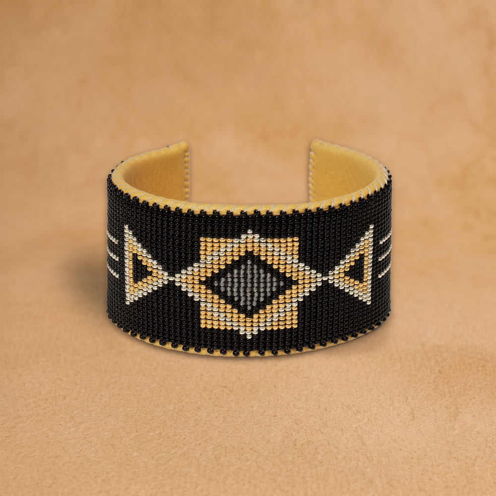 Raven X Large beaded cuff, black with gold triangles and a grey diamond, handloomed by Navajo artisans in New Mexico