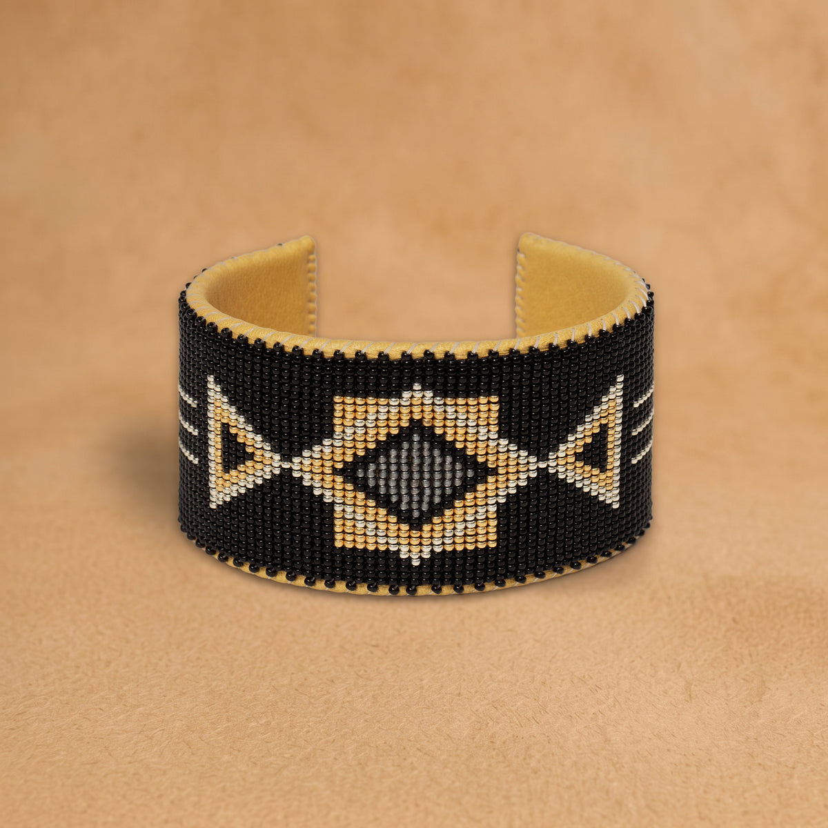Raven X Large beaded cuff, black with gold triangles and a grey diamond, handloomed by Navajo artisans in New Mexico