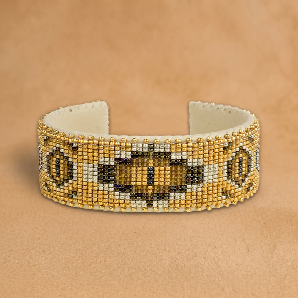 Sahara Large beaded cuff, gold with a bronze and olive medallion, handloomed by Navajo artisans in New Mexico