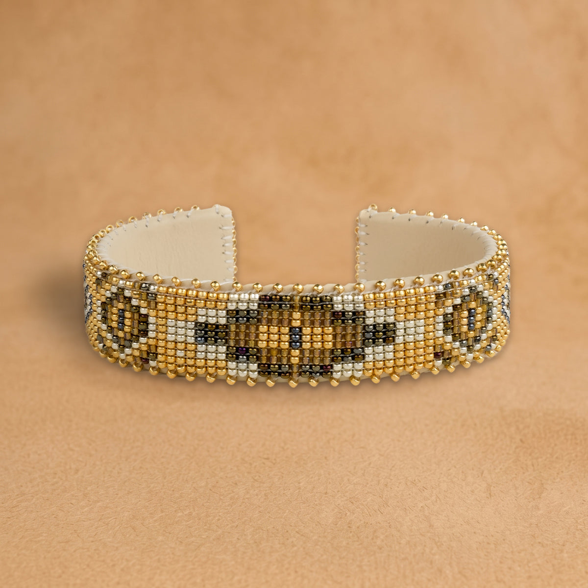 Sahara Medium beaded cuff, gold with a bronze and olive medallion, handloomed by Navajo artisans in New Mexico