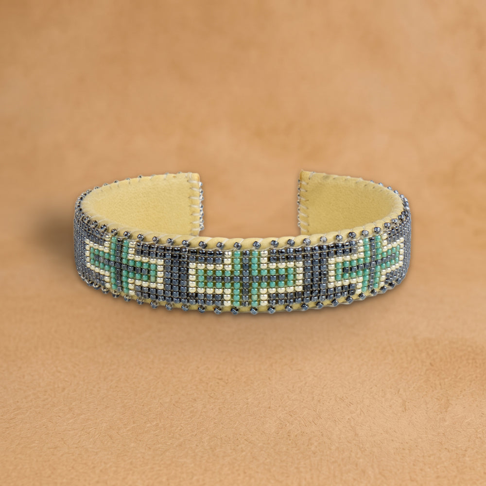 Tia Small beaded cuff, slate grey with turquoise and white crosses, handloomed by Navajo artisans in New Mexico