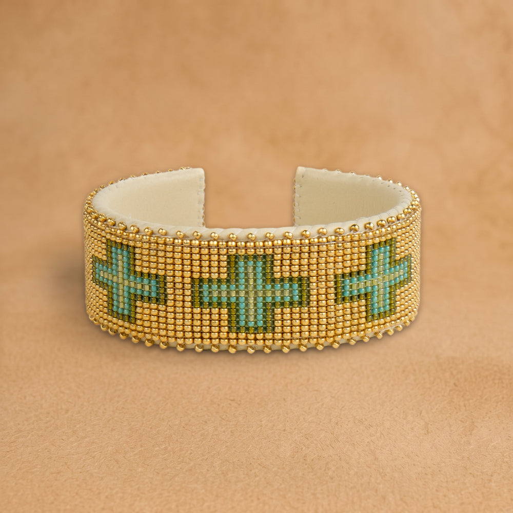 Torian Large beaded cuff, gold with turquoise and green crosses, handloomed by Navajo artisans in New Mexico
