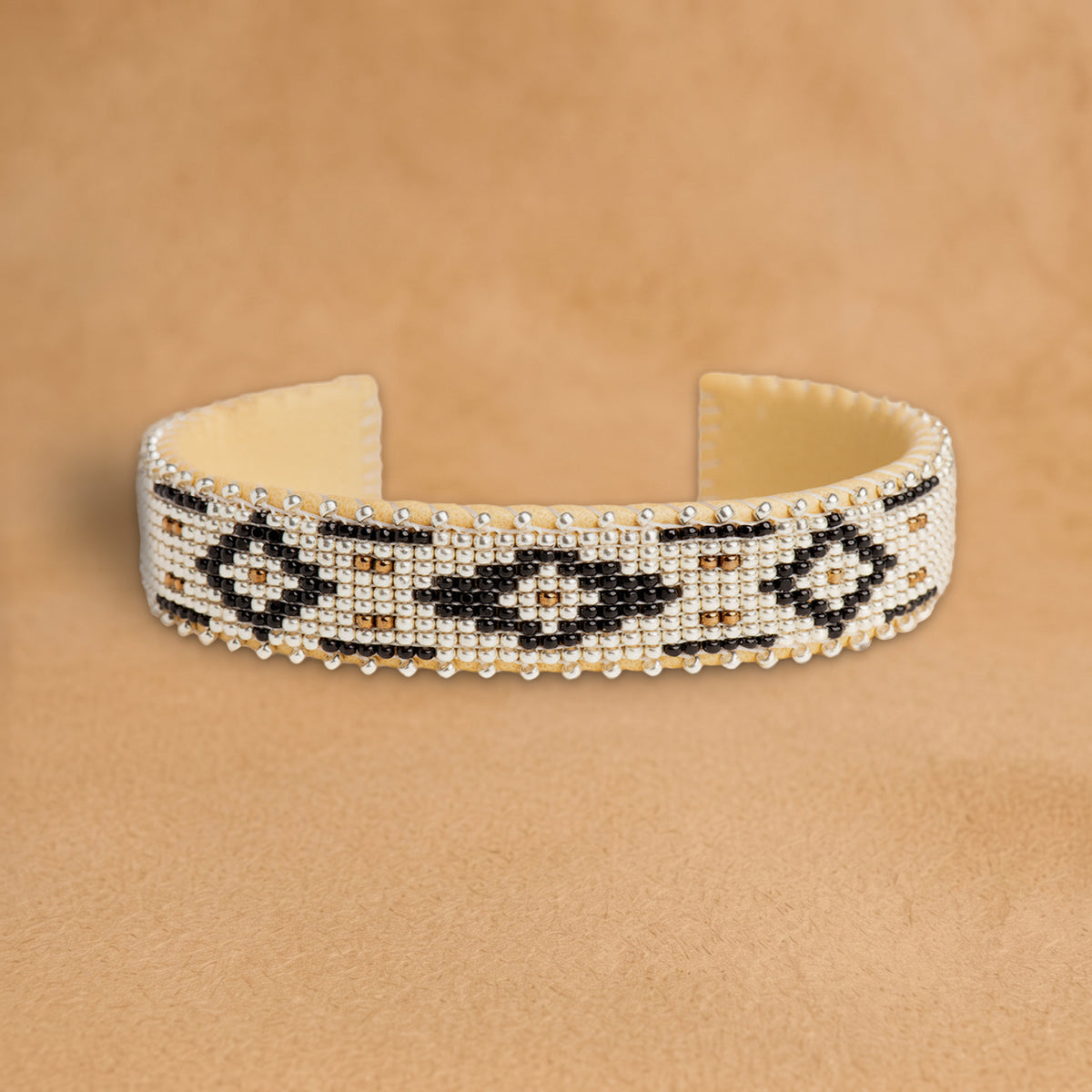 Zaylee Small beaded cuff, white with black diamonds and bronze accents, handloomed by Navajo artisans in New Mexico